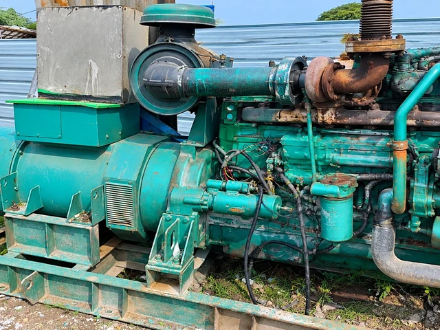Expert Indian generator technician performing engine maintenance and calibration